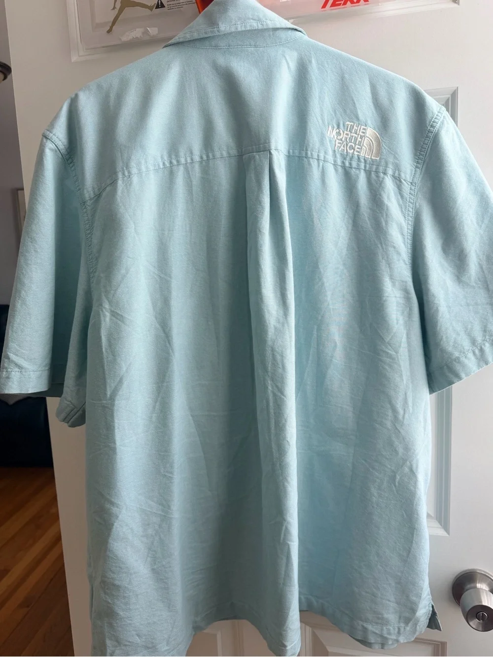 The North Face Light Blue Short-Sleeve Button-Up Shirt with Orange Logo